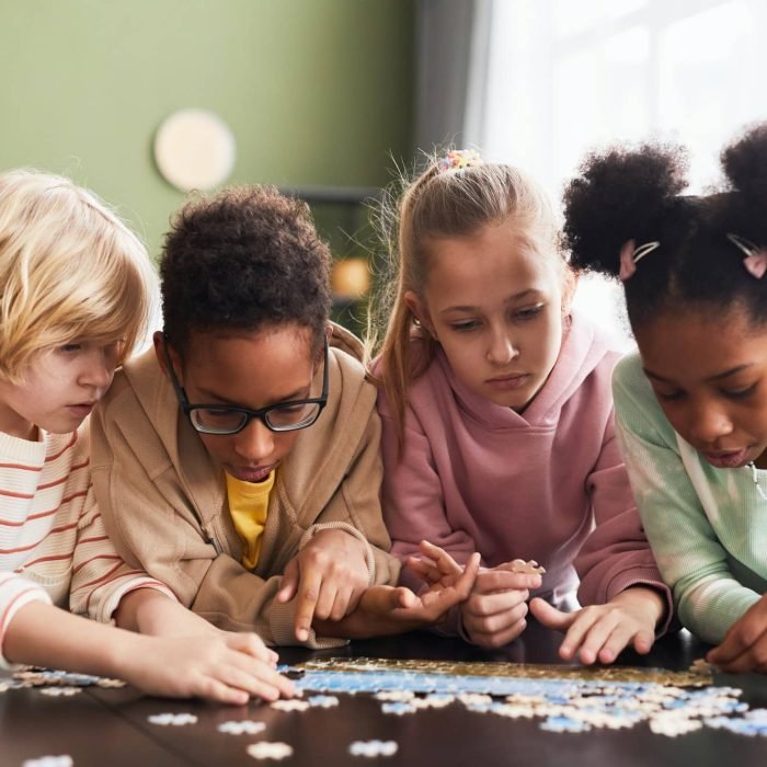 group-of-kids-playing-with-puzzle.jpg group-of-kids-playing-with-puzzle.jpg